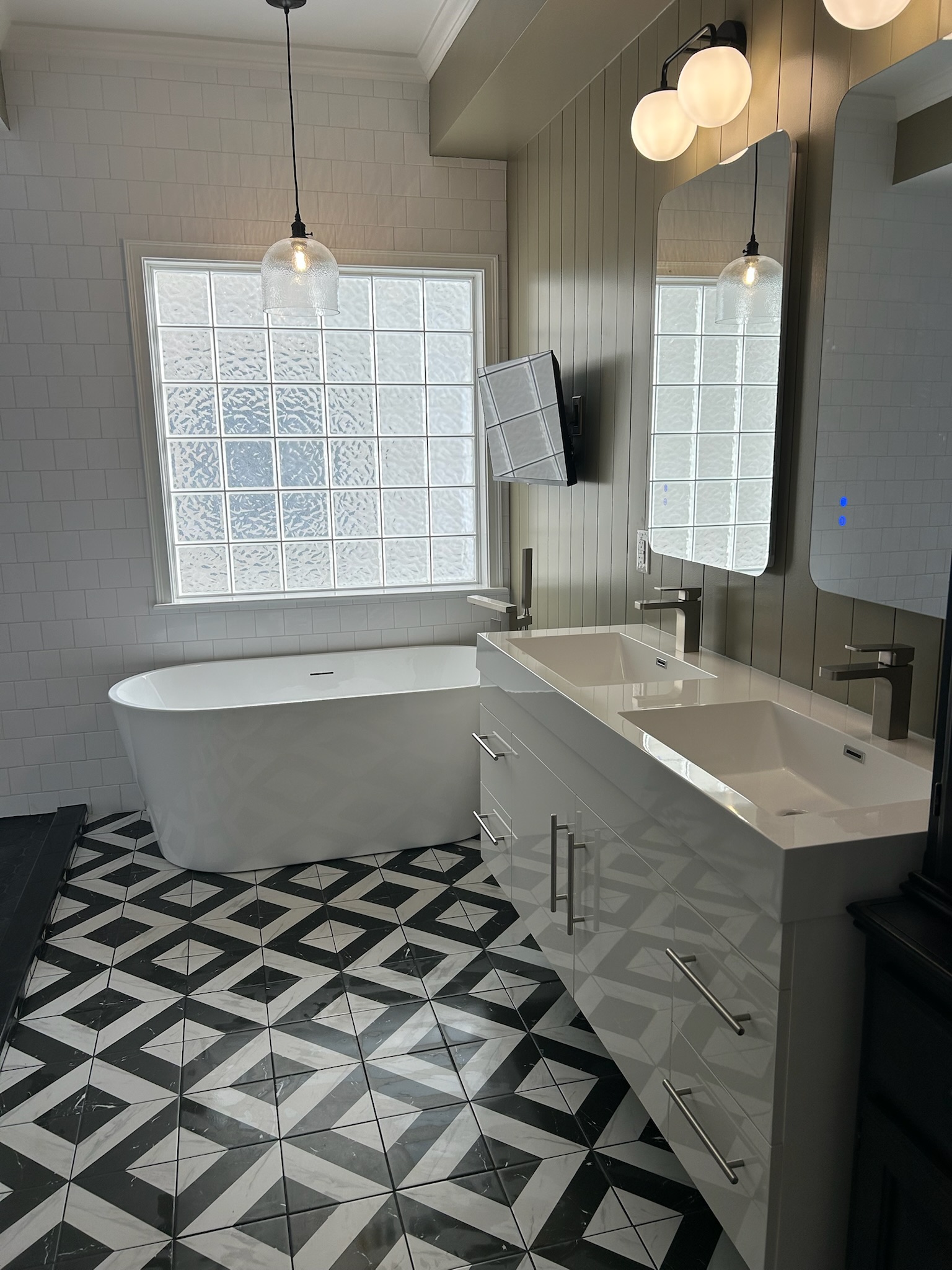 Full master bathroom remodel with geometric tile floor and freestanding tub in Upstate SC